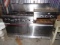 GARLAND 6 BURNER WITH 24 INCH GRIDDLE AND DBL OVEN ONE CASTER MISSING SHIPP