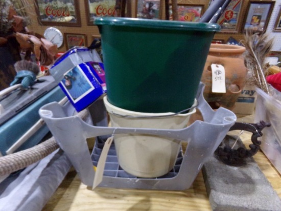 FOOT STOOL AND BUCKETS SINK WRENCHES SCRUB BRUSH AND SUN 600 CAMERA