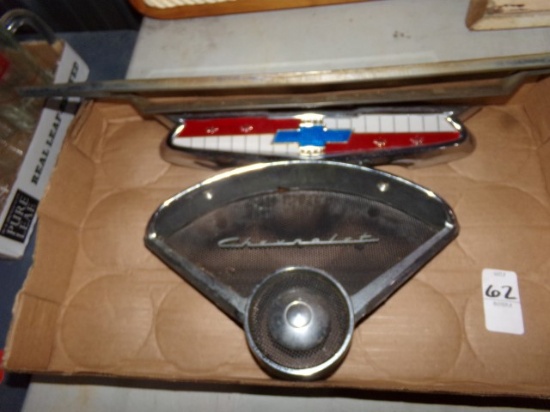 BOX OF VINTAGE CHEVROLET EMBLEMS 1950 AND 1960