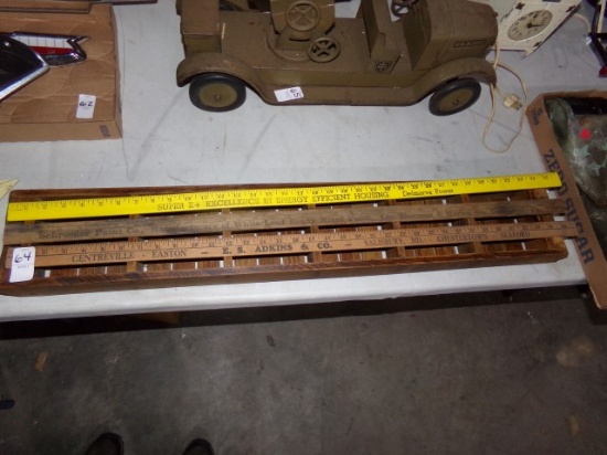 COLLECTION OF THREE ADVERTISING YARD STICKS AND SMALL SHELF UNIT