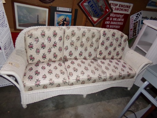 WICKER SOFA WITH FLORAL CUSHIONS