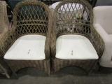 PAIR OF RATTAN ARM CHAIRS WITH WHITE CUSHIONS