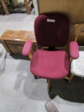 RED UPHOLSTERED OFFICE CHAIR