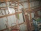 CORNER BARN CONTENT LOT INCLUDING WHEEL BARROW LADDERS AND MORE