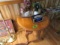 OAK END TABLE OVAL SHAPED WITH CONTENTS OF LAMP AND RADIO AND MORE