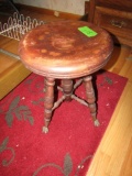 ANTIQUE PIANO STOOL WITH BRASS CLAW FEET