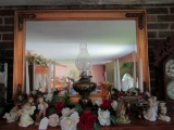 GILT FRAMED MIRROR AND CONTENTS ON FIREPLACE MANTEL INCLUDING FIGURINES CAN