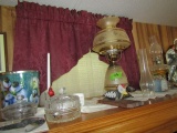 CONTENT ONE TOP OF ENTERTAINMENT CENTER INCLUDING OIL LAMPS COIN GLASS AND