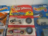 10 HOT WHEELS INCLUDING 9 WITH MATCHING COLLECTOR BUTTONS IN ORIGINAL PACKA