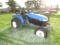 #1303 NEW HOLLAND TRACTOR TC33D SUPER BOMER 4 WD TURF TIRES WITH GOOD TREAD