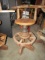 PRIMITIVE MADE BAR STOOL WITH WOODEN WAGON HUB BASES APPROX 3 1/2 FEET TALL