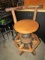 PRIMITIVE MADE BAR STOOL WITH WOODEN WAGON HUB BASES APPROX 3 1/2 FEET TALL