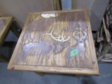 CARVED END TABLE WITH MOOSE ELK BEAR AND DEER CARVED IN TOP APPROX 27 X 27