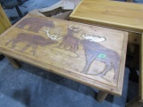 COFFEE TABLE WITH MOOSE ELK BEAR AND DEER CARVED IN TOP APPROX 27 X 48 INCH