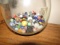BOWL FULL OF ANTIQUE MARBLES AND SHOOTERS