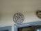 COLLECTION OF PLATES ON WALL INCLUDING MEXICAN POTTERY ROSE MEDALLION GAME
