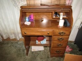 SMALL ROLL TOP DESK AND CONTENTS INCLUDING PAPER STAPLERS AND MORE