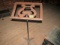 ANTIQUE MUSIC STAND WITH WROUGHT IRON BASE AND WOODEN TOP