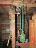 WALL LOT INCLUDING POST HOLE DIGGERS SAWS CHAIN TIGHTENERS AND MORE