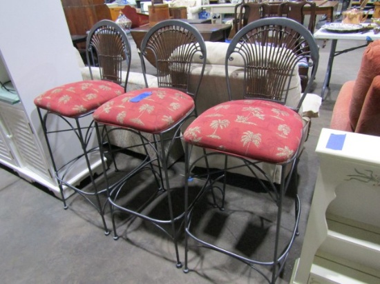 THREE WROUGHT IRON BAR STOOLS WITH RATTAN BACKS AND UPHOLSTERED SEATS AND P