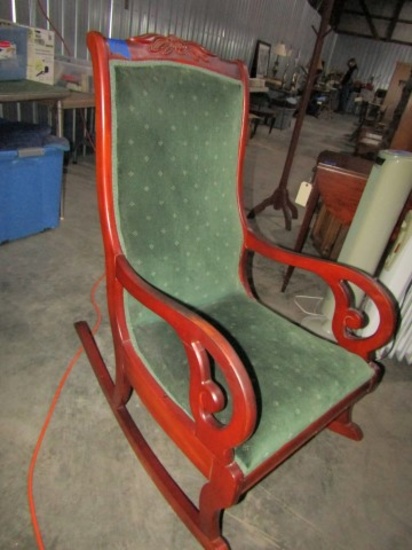 MAHOGANY LADIES ROCKER WITH CARVED BACK GREEN UPHOLSTERY