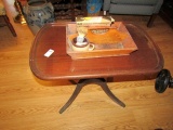 MAHOGANY TABLE WITH BRASS CAP PAW FEET AND FLATWARE HOLDER