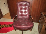 LEATHER OFFICE CHAIR WITH WOODEN ARMS ON CASTERS