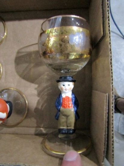 7 WEST GERMAN CORDIALS WITH GOLD GILD AND FIGURINE STEMS