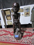 HAND CARVED STATUE 28 INCH TALL X BASE 9 INCH ACROSS LEFT ARM BROKEN