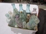 BOX OF ANTIQUE BOTTLES INCLUDING MEDICINE BOTTLES SODA BOTTLES AND PERFUME