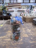 COLLECTION OF ANTIQUE AND CLAY MARBLES IN BOTTLE