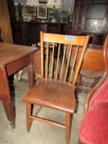 ANTIQUE PLANK BOTTOM SIDE CHAIR WITH CARVED BACK