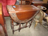 ANTIQUE GATE LEG DROP LEAF TABLE WITH HEAVILY CARVED TOP