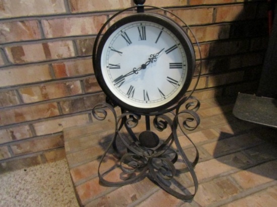 BATTERY OPERATED CLOCK WROUGHT IRON STAND APPROX 12 INCH TALL