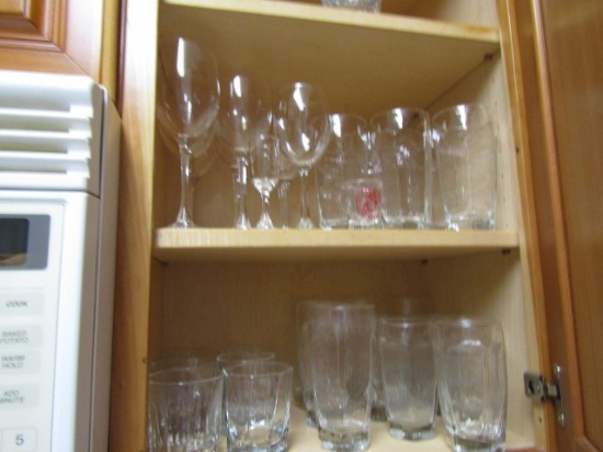CONTENTS OF 2 CABINETS INCLUDING WINE GLASSES WATER GLASSES TOASTER BOWL AN
