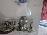 CONTENTS OF WASH STAND INCLUDING NICKEL LAMP WATERFOWL FIGURINES BRASS CLOC