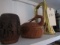 SHELF LOT INCLUDING BRASS BUGLE COVERED BASKETS WOODEN MUGS AND MORE