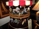 BATTERY OPERATED 2 TIER CAROUSEL APPROX 16 INCH TALL X 12 INCH ACROSS