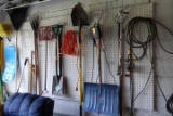 LOT OF GARDEN TOOLS SHOVELS RAKES EXTENSION CORDS AND MORE