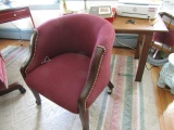 PAIR OF UPHOLSTERED ARM CHAIRS ON CASTERS