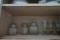 CONTENTS OF KITCHEN CABINET INCLUIDNG CLEAR GLASS CANISTERS OIL AND VINEGAR