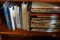 CONTENTS OF CABINET INCLUDING AMBER GLASS AND COLLECTION OF COOKBOOKS