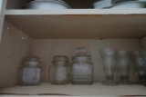 CONTENTS OF KITCHEN CABINET INCLUIDNG CLEAR GLASS CANISTERS OIL AND VINEGAR