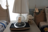 TOP OF NIGHT STAND INCLUDING CLEAR GLASS LAMP CD PLAYER ETC