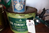 CABINET WITH VINTAGE CANS CLEANING SUPPLIES YARD SPRINKLERS AND MORE