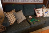 GREEN UPHOLSTERED SOFA WITH PILLOWS