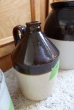 1/2 GALLON SIZE BROWN AND WHITE WHISKEY JUG