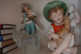 SHELF LOT WITH PIANO BABIES ANDRE FIGURINES DANIELLE STEEL NOVELS
