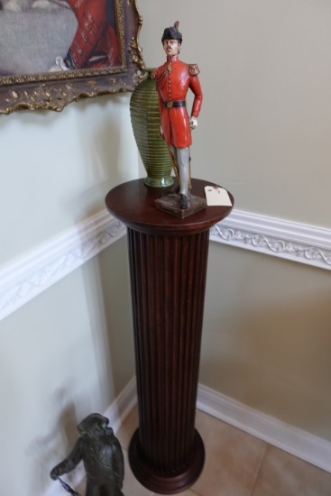 WALNUT COLOR PEDESTAL 40 INCH TALL WITH SOLDIER FIGURINE AND VASE