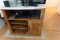 SMALL ENTERTAINMENT CENTER NATURAL FINISH WITH CONTENTS OF DVD PLAYER ETC